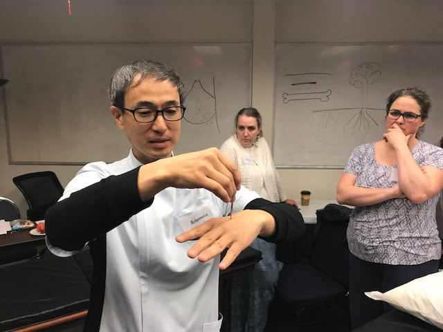 Timely Topics Nakamura Sensei demonstrating golden Teishin needle